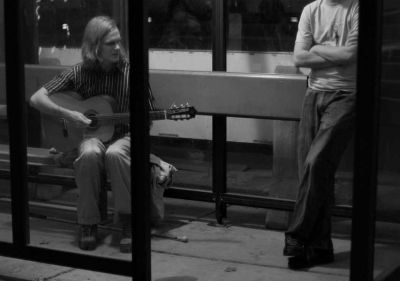 Matthew Hope Playing at a Bus Stop