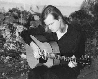 Matthew Hope Playing on a Boardwalk