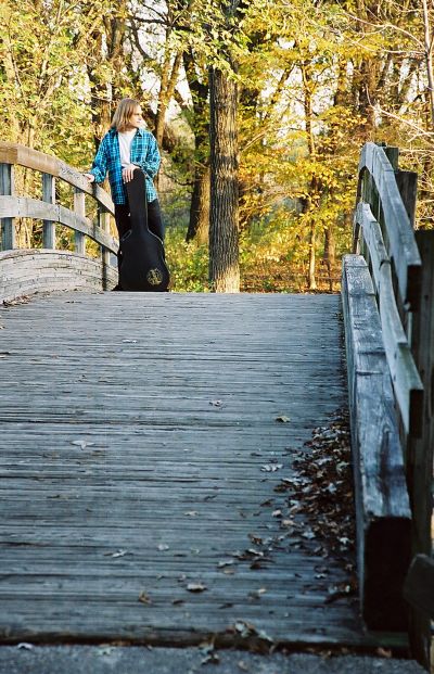 Matthew Hope Standing Atop a Bridge