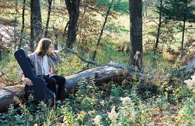 Matthew Hope Sitting on a Log